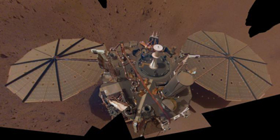 This is NASA InSight's second full selfie on Mars. Since taking its first selfie, the lander has removed its heat probe and seismometer from its deck, placing them on the Martian surface; a thin coating of dust now covers the spacecraft as well.